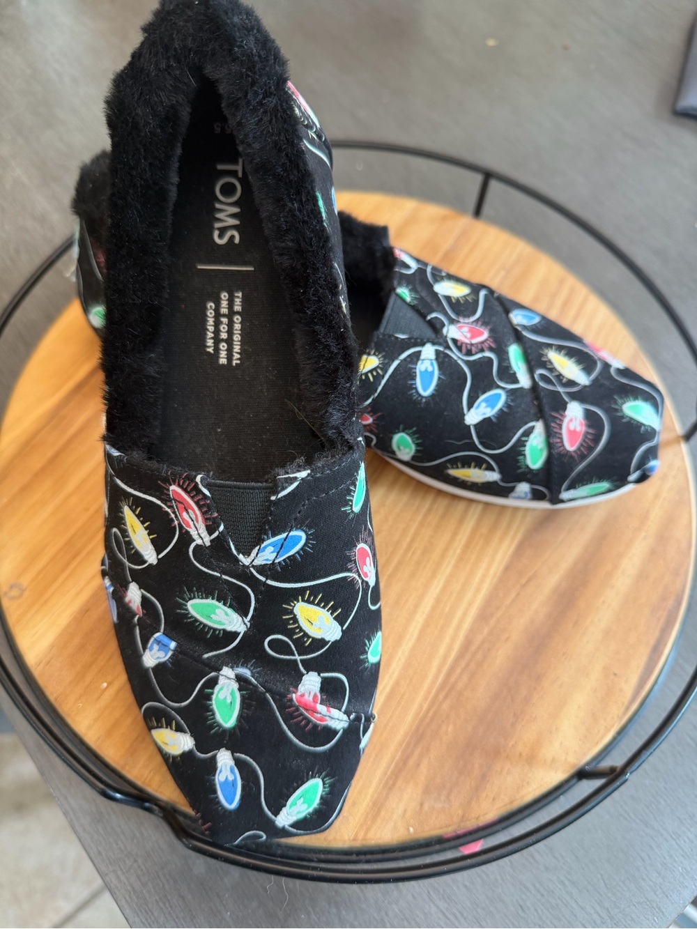 TOMS Women's Black Slip-On Moccasins with Multicolor Light Bulb Print